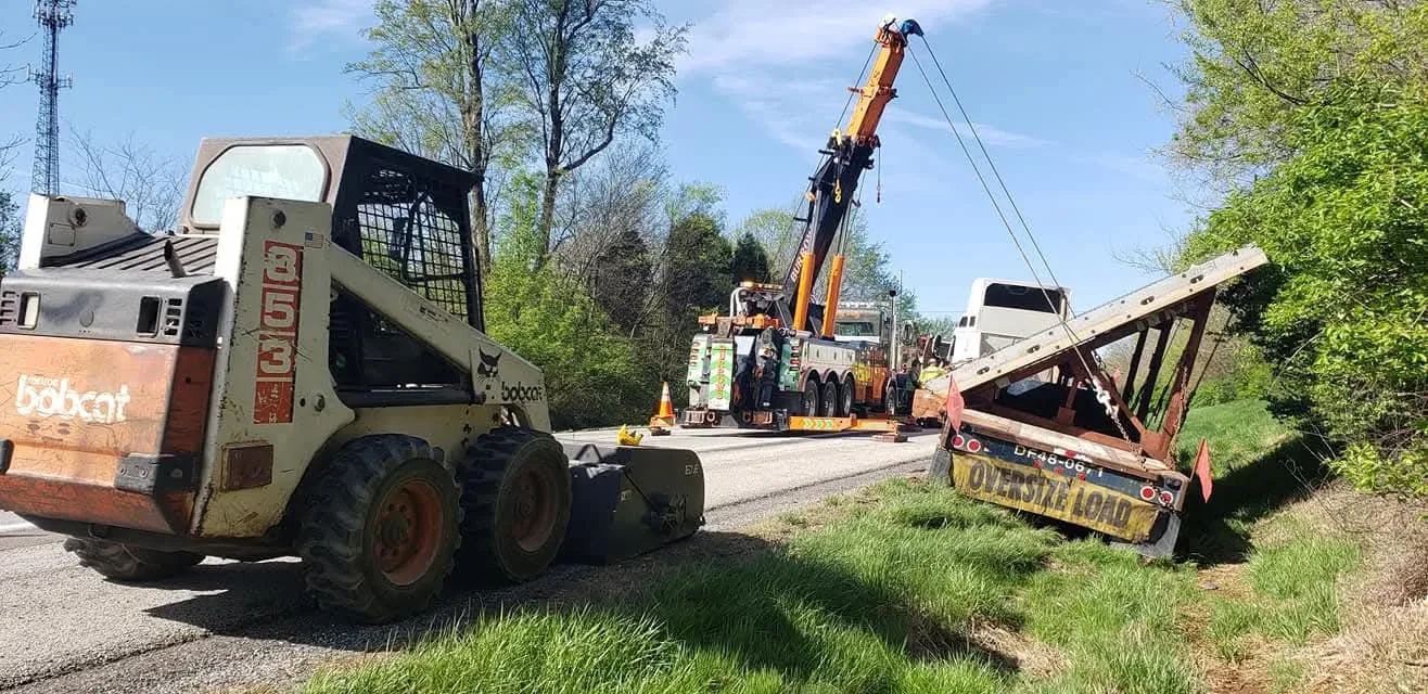 Burrows crew recovering heavy equipment and a trailer