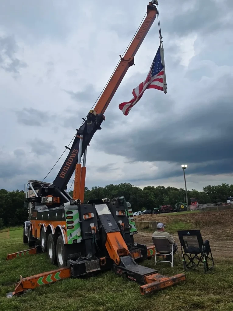 Burrows crane truck with an American flag