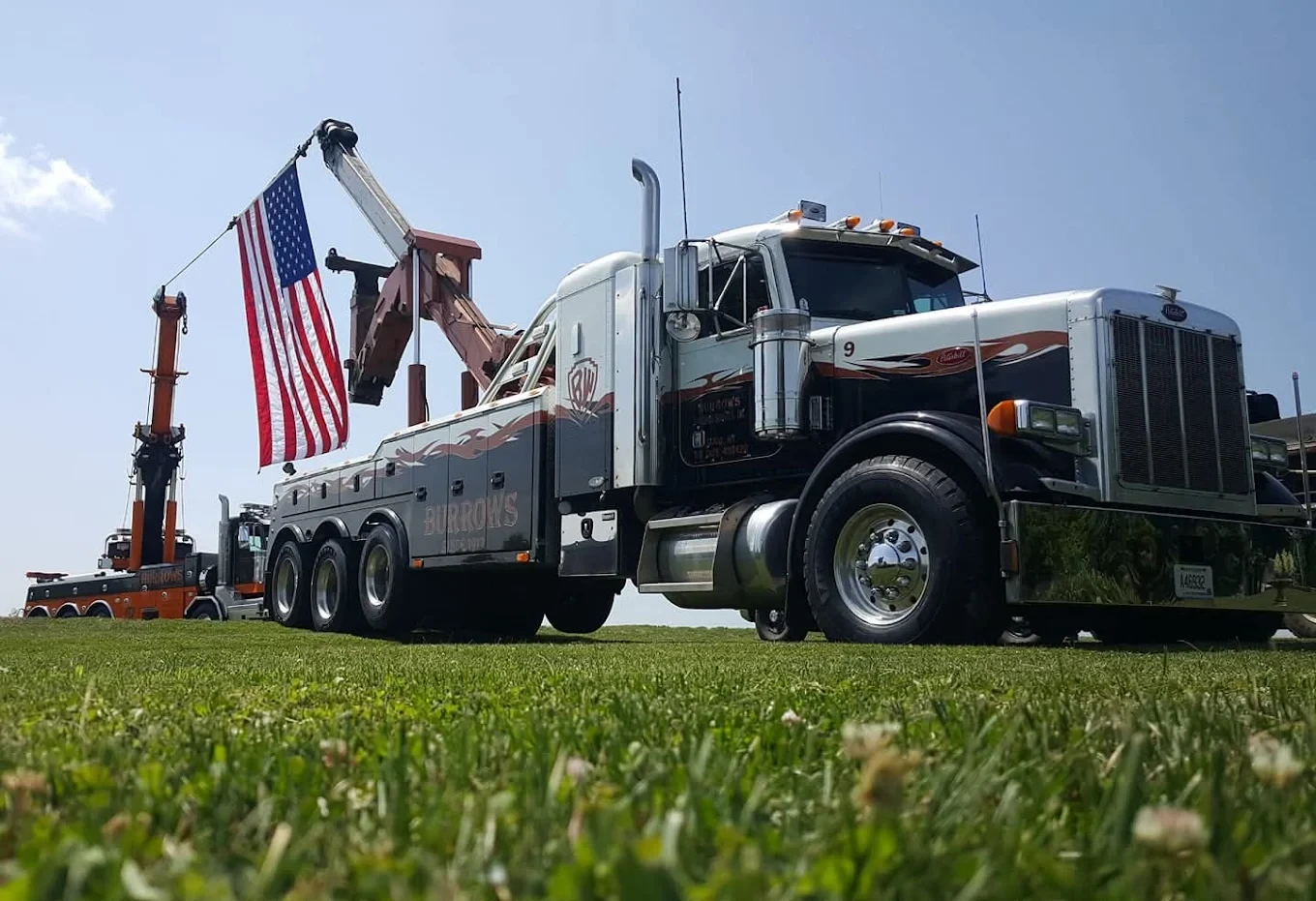 Burrows heavy-duty wrecker fleet with an American flag
